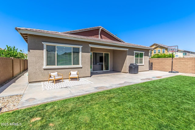 4077 S Quinn Ave, Gilbert, AZ 85297 - rear view of property with a lawn, a fenced backyard, a patio area, and stucco siding