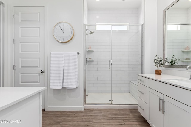 4077 S Quinn Ave, Gilbert, AZ 85297 - bathroom with a stall shower, wood finished floors, and vanity