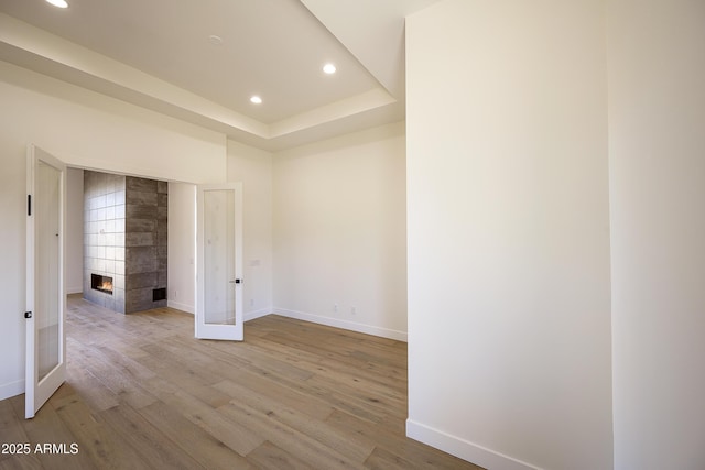 13290 E Ln Junta Rd, Scottsdale, AZ 85255 - empty room with recessed lighting, light wood-style flooring, baseboards, and a multi sided fireplace