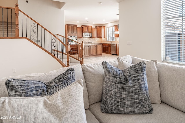 living room featuring stairs and recessed lighting