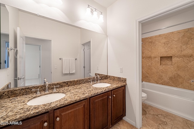 full bathroom featuring toilet, double vanity, and shower / bath combination