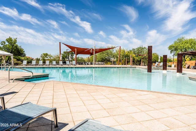 community pool featuring a patio and a gazebo