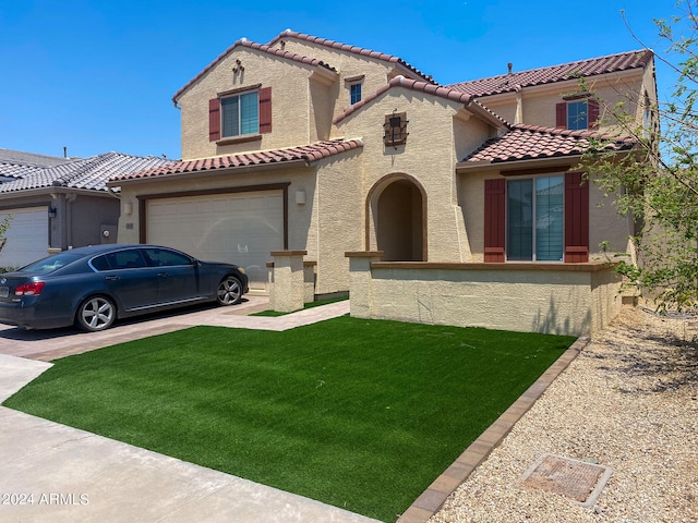 mediterranean / spanish-style home featuring a front yard