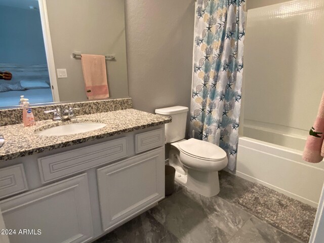 full bathroom featuring vanity, toilet, and shower / tub combo with curtain