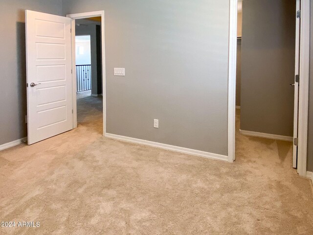 interior space featuring light colored carpet