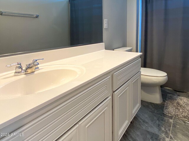 bathroom with vanity and toilet