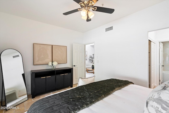 bedroom with ceiling fan and tile patterned floors