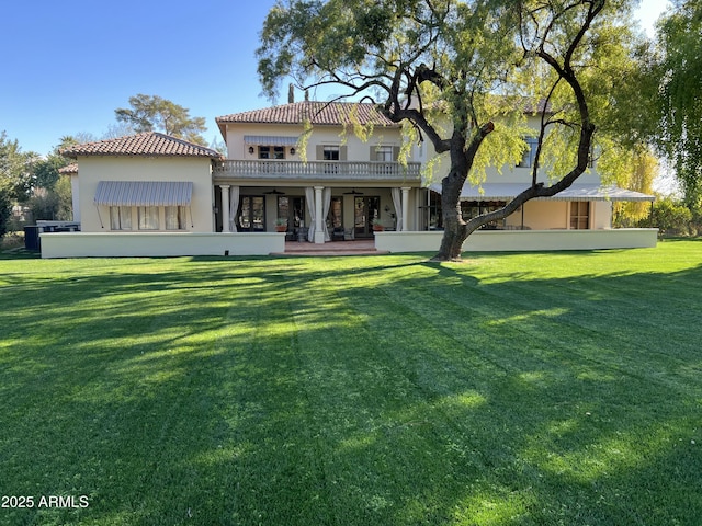 3006 N Manor Dr W, Phoenix, AZ 85014 - back of property featuring a tiled roof, a yard, and stucco siding
