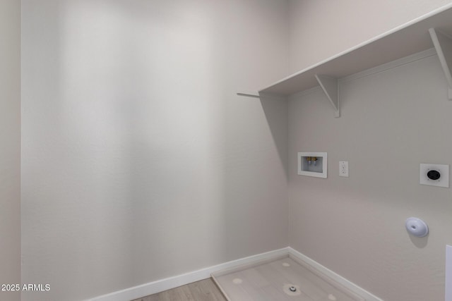 laundry area featuring laundry area, baseboards, light wood-type flooring, washer hookup, and electric dryer hookup