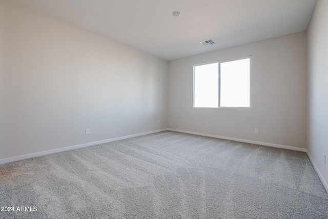 unfurnished room featuring carpet floors