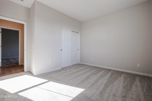 unfurnished bedroom featuring carpet