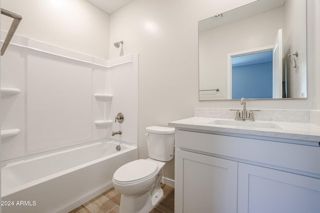 full bathroom with washtub / shower combination, vanity, and toilet