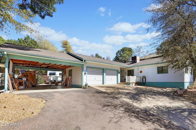 1417 N Easy St, Payson, AZ 85541 - view of front of property featuring an attached garage, driveway, and a chimney