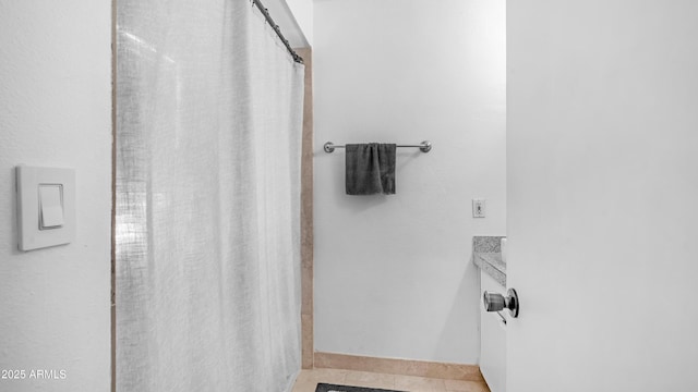 10420 N 10th St Unit 2, Phoenix, AZ 85020 - full bath with baseboards, curtained shower, and tile patterned flooring