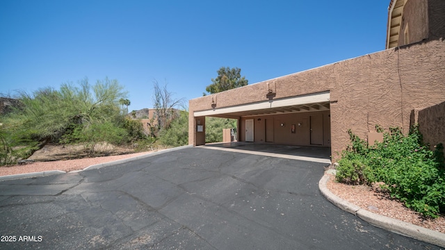 10420 N 10th St Unit 2, Phoenix, AZ 85020 - view of home's exterior with covered parking and stucco siding