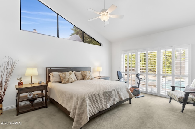 carpeted bedroom with high vaulted ceiling and ceiling fan