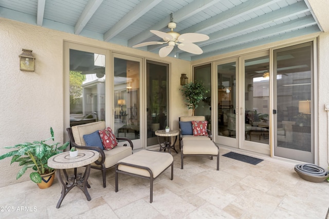 view of patio with french doors and a ceiling fan