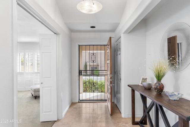 foyer featuring baseboards