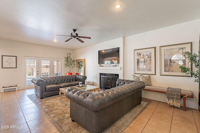 1125 S Larkspur St, Gilbert, AZ 85296 - living room featuring light tile patterned flooring, a ceiling fan, a fireplace, recessed lighting, and baseboards
