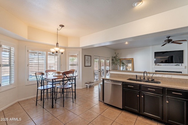 1125 S Larkspur St, Gilbert, AZ 85296 - kitchen with stainless steel dishwasher, a sink, light tile patterned floors, and light countertops
