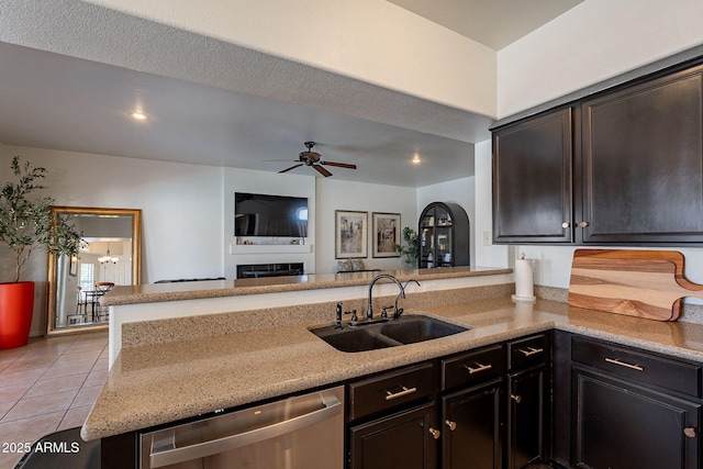1125 S Larkspur St, Gilbert, AZ 85296 - kitchen featuring a sink, stainless steel dishwasher, light tile patterned floors, a ceiling fan, and a peninsula