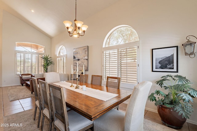 1125 S Larkspur St, Gilbert, AZ 85296 - dining space featuring high vaulted ceiling, a chandelier, light tile patterned floors, and baseboards