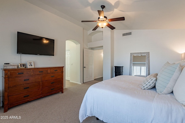 1125 S Larkspur St, Gilbert, AZ 85296 - bedroom with light carpet, lofted ceiling, arched walkways, and ceiling fan