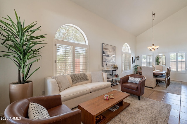 1125 S Larkspur St, Gilbert, AZ 85296 - living area featuring high vaulted ceiling, a chandelier, light tile patterned floors, and baseboards