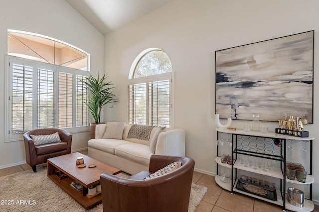1125 S Larkspur St, Gilbert, AZ 85296 - living area with lofted ceiling, tile patterned flooring, and baseboards