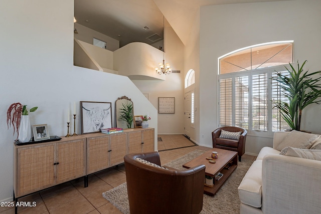 1125 S Larkspur St, Gilbert, AZ 85296 - living area with a towering ceiling, tile patterned flooring, a chandelier, and baseboards