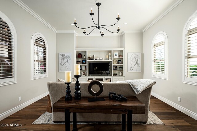 dining room featuring dark wood-type flooring, crown molding, and a notable chandelier