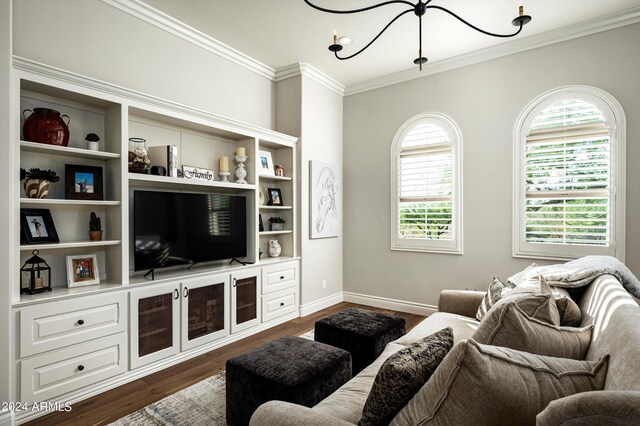 living room featuring light wood-type flooring, ceiling fan, and crown molding