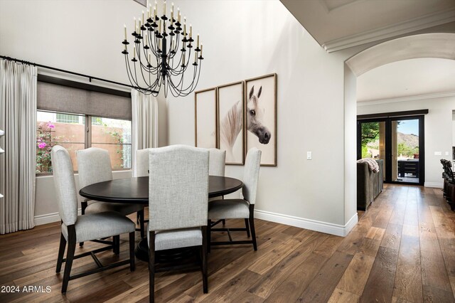 living room featuring wood-type flooring and ornamental molding