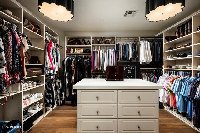 bedroom with ceiling fan, dark wood-type flooring, and ornamental molding