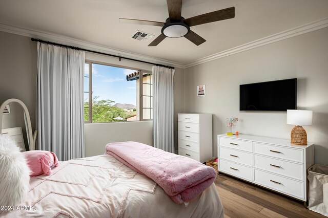 workout area with ceiling fan, vaulted ceiling, and hardwood / wood-style floors