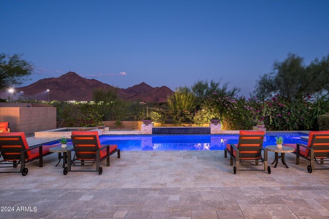 view of patio featuring a grill and an outdoor living space with a fire pit