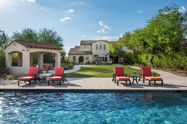 exterior space featuring a mountain view and pool water feature