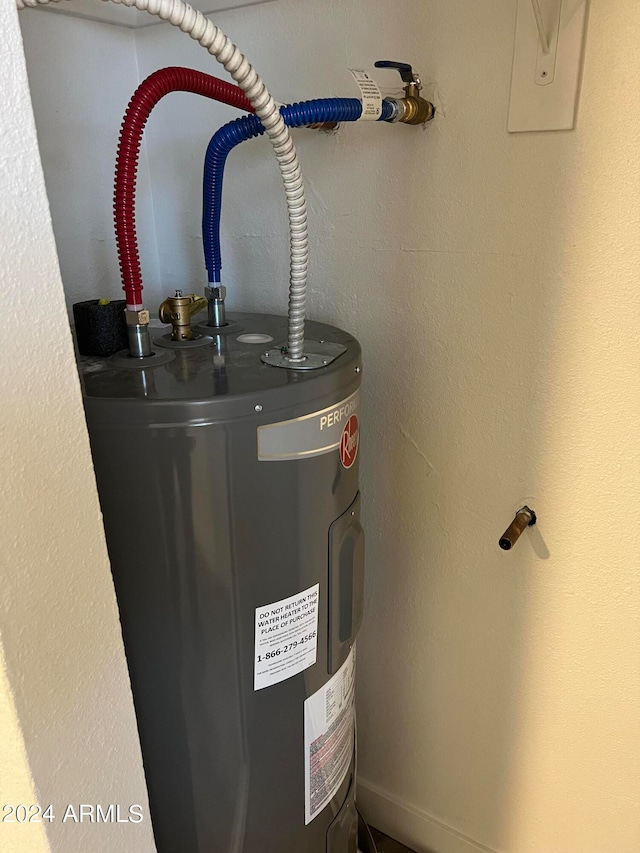 utility room featuring electric water heater