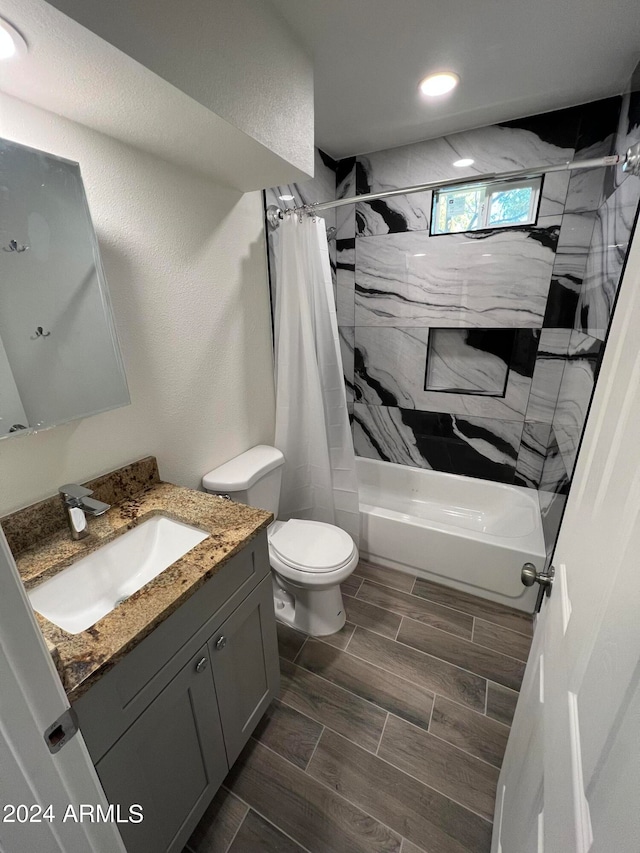 full bathroom featuring vanity, toilet, and shower / bath combination with curtain