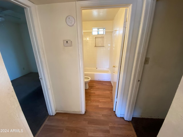 corridor featuring dark hardwood / wood-style flooring