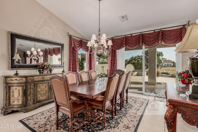 dining space featuring an inviting chandelier, light tile patterned floors, visible vents, and vaulted ceiling