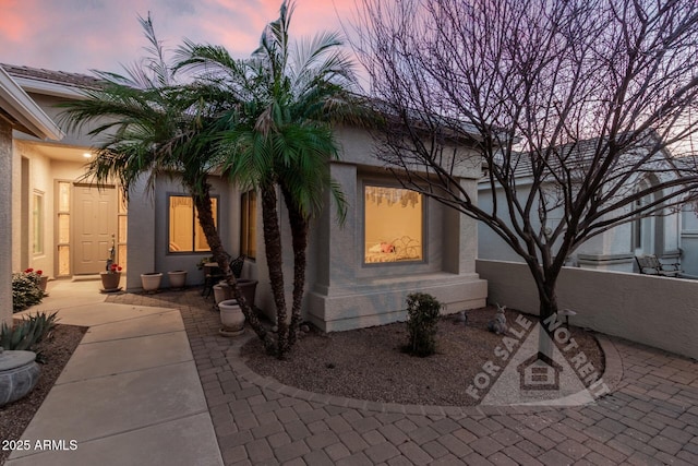 exterior space with stucco siding