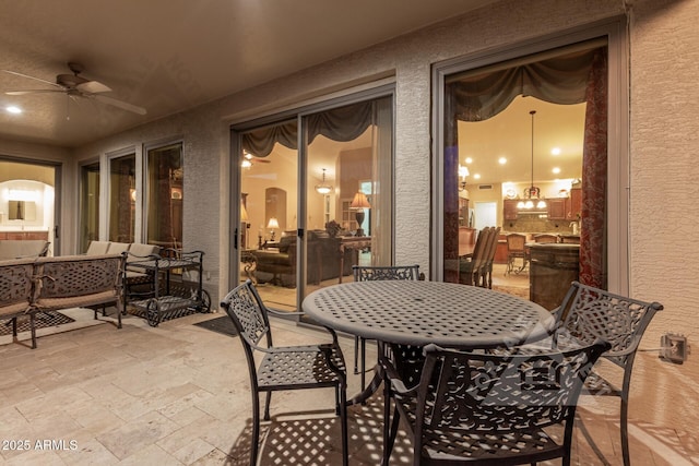 view of patio / terrace featuring outdoor dining space and a ceiling fan