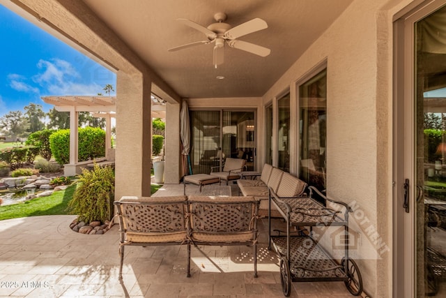 view of patio / terrace featuring ceiling fan and an outdoor living space