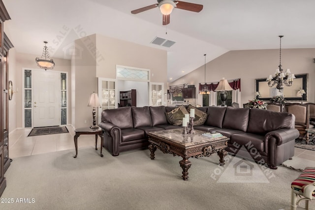 carpeted living area featuring ceiling fan, high vaulted ceiling, visible vents, and tile patterned floors