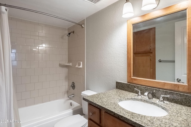 bathroom with visible vents, toilet, a textured wall, shower / bath combination with curtain, and vanity