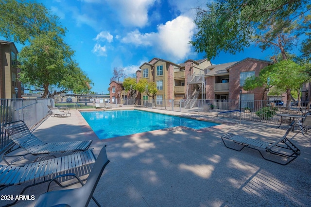 view of swimming pool with a patio area