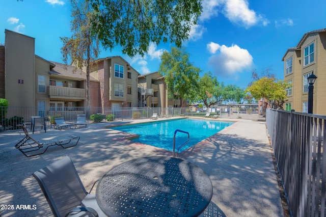 view of swimming pool featuring a patio area