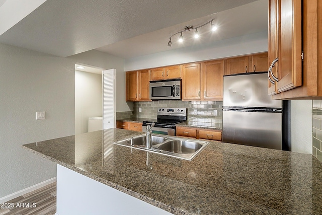 kitchen with decorative backsplash, sink, stainless steel appliances, and dark wood-type flooring