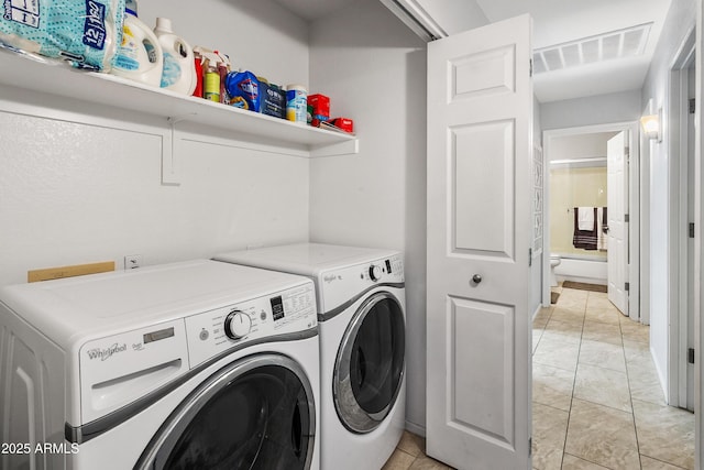 4704 E Melinda Ln, Phoenix, AZ 85050 - washroom with separate washer and dryer and light marble finish floors